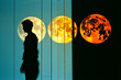 Abstract silhouette of a person with the phases of the moon within.