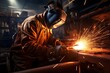 industrial worker is welding steel products in the factory