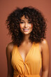 © Synthetica - Beautiful smiling african american woman with curly hair, isolated on brown