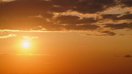Wall Mural - Sunset paints the evening sky with vibrant red clouds, time lapse.