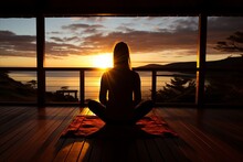 Tranquil Woman Gracefully Practicing Yoga On Her Sun Kissed Balcony At The Glorious Onset Of Sunrise