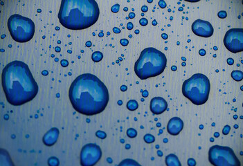 Water drops on a metallic background