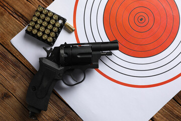 Sticker - Shooting target, handgun and bullets on wooden table, top view