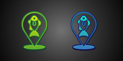 Poster - Green and blue Location fishing icon isolated on black background. Fishing place. Vector