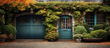 Autumn-colored Ivy Surrounds A Wooden Garage Door.