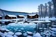 A frozen lake surrounded by wooden cabins, with clear skies and delicate snowflakes dancing in the cold winter air.