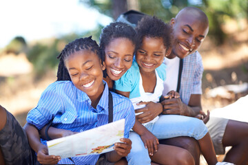 Wall Mural - Happy, map or black family hiking in forest to relax or bond in park or holiday vacation together in nature. Children, mom or African father in woods on fun adventure reading location directions