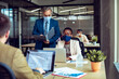 © Marko Geber - Business meeting in office with employees wearing face masks