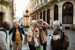 © Davor - Diverse senior people having fun in city on vacation