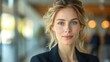 © suphakphen - portrait of a business woman in suit, beautiful confident woman in office with blurred staff working background