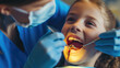 A child on a dentist appointment getting the mouth check for healthy teeth