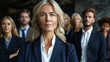 © Viorel Sima - mature confident businesswoman posing in front of her colleagues