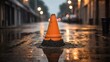 Several bright orange traffic cones protrude on the asphalt