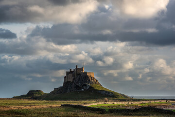 Wall Mural - Stunning dramatic landscape image of Lindisfarne, Holy Island in Northumberland England during Winter