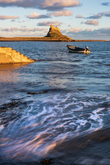 Wall Mural - Stunning dramatic landscape image of Lindisfarne, Holy Island in Northumberland England during Winter