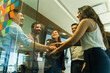 © AntonioDiaz - Happy and diverse group of businesspeople having fun together and working as a team