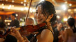 Cute Asian female musician playing violin on stage in a restaurant, closeup of hand playing violin, happy smile, eye level shot, audience applauding in the background.