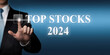 Top Stock Picks of the year 2024 - finger pressing virtual touchscreen button