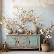Blue cabinet with magnolia flowers in pots and vases