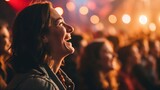 Fototapeta  - Woman laughing joyfully at a concert, surrounded by lights
