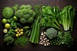 Green vegetables and fruits on a wooden table
