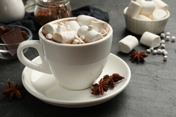 Sticker - Tasty hot chocolate with marshmallows on dark textured table, closeup