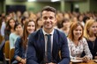 © duyina1990 - Male professor sitting in a lecture hall full of female students