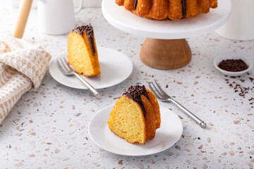 Wall Mural - Orange bundt cake topped with chocolate ganache cut into slices