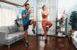 © Summit Art Creations - Athletic and sporty fitness couple or exercise buddy running posture at home body workout exercise session for fit physique and healthy sport lifestyle at home. Gaiety home exercise workout training.