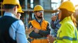 © buraratn - team of construction engineers talks to managers and construction workers at the construction site.
