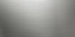 Seamless brushed metal plate background texture.