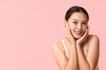 Poster - Beautiful young Asian woman on pink background