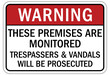 No vandalism warning sign and labels these premises are monitored. Trespassers and vandals will be prosecuted