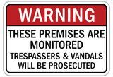 Fototapeta  - No vandalism warning sign and labels these premises are monitored. Trespassers and vandals will be prosecuted