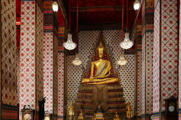 Wall Mural - Golden Buddha statue in Wat Arun buddhist temple in Bangkok Thailand Wat Arun is a Buddhist temple in Bangkok Yai district on the Thonburi west bank of the Chao Phraya River