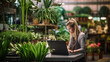 © Tahsin - Beautiful women shop assistants working with a laptop in a potted plant store, showcasing the down-to-earth nature of a small business