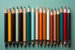 Aesthetic view of a diverse array of school pens against a light green surface
