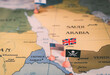 Flags of the United States and United Kingdom surrounding a pirate insignia onto a map of the Red Sea region. vertical video. It symbolically represents the intricate geopolitical dynamics and