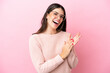 © luismolinero - Young Italian woman isolated on pink background With glasses and applauding