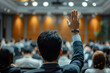 © lc design - Photo of people asking questions or making presentations, journalists raising their hands in the audience