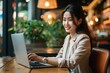 ノートパソコンを開いている笑顔のアジア人女性, Generative AI