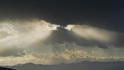 Wall Mural - timelapse with sunlight and moving sunbeams and mountain landscape