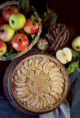 Sticker - Homemade apple pie on dark rustic background, top view. Classic autumn dessert