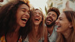 Photo of a group of young people laughing merrily