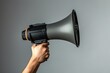 © ParinApril - Hand Holding a Megaphone in an Advertising and Marketing Context