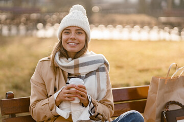 Wall Mural - stylish woman walking in winter street