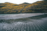 Fototapeta Na ścianę - landscape with black shore and sand waves in the faroe islands by the mountains