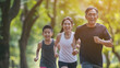 © Sasint - Asian family exercising and jogging together at the park. Group of Asian father mother and daughter stretching after sport. Sports healthcare medical spring summer together family's day concept.