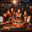 © DALU11 - Asian friends having barbecue dinner together.