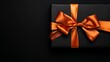 © Pasinee - Luxury Surprise: Stylish Black Giftbox Isolated on Shiny Orange Background, Ideal for Anniversaries and Festive Events
